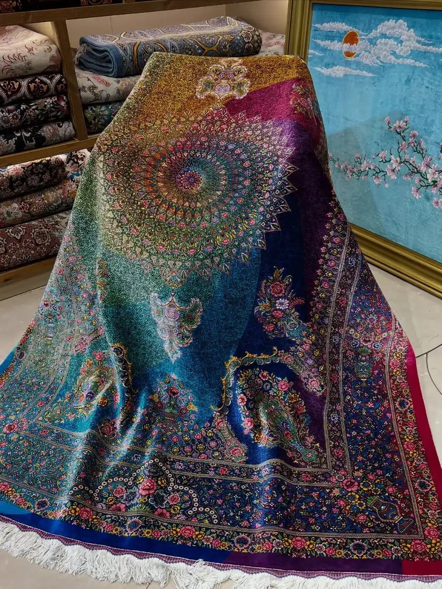 Silk Qom carpet PRR-HM-001 draped over a chair, revealing a multicolour radial rosette and floral borders